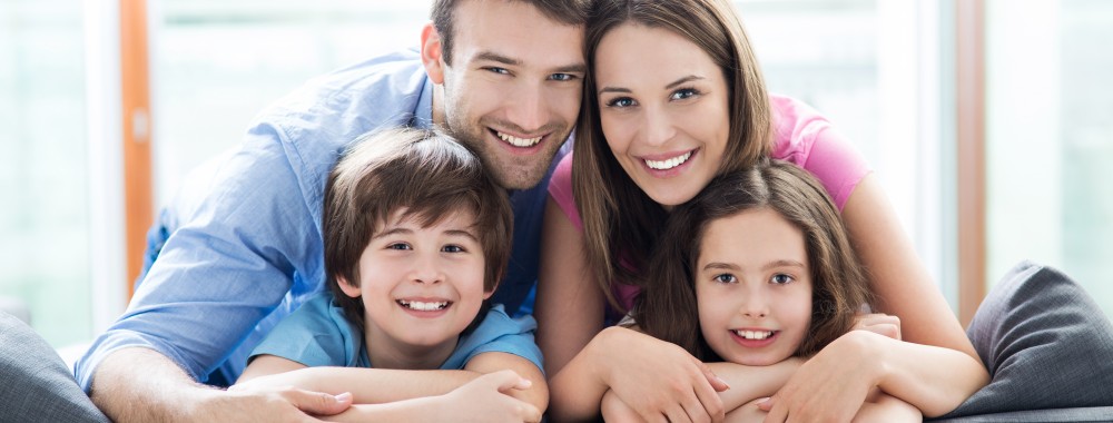 Family,Relaxing,On,Sofa