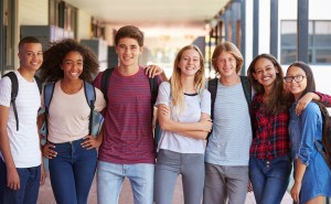 Teenage,Classmates,Standing,In,High,School,Hallway